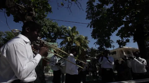 Musicians play during procession honoring dead in 2010 earthquake in Haiti. Video stock 170157490