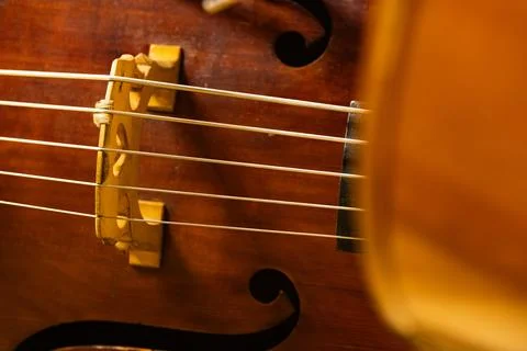 Musicians playing cellos during classical orchestra concert close up Stock Photos