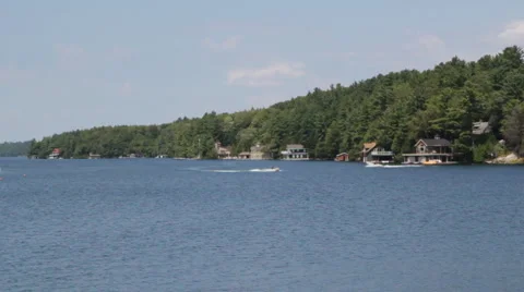 Muskoka shoreline with boat traffic. Stock Footage