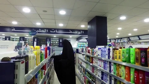 Muslim in the Black in the Pharmacy. Video stock 76246593
