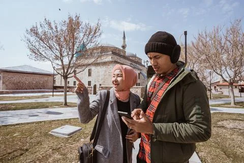 Muslim couple looking for direction while traveling to konya turkiye Stock Photos