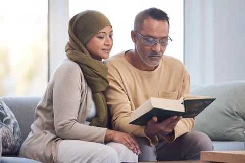 Muslim couple, reading Quran and spiritual with islam, hijab and book for faith Stock Photos