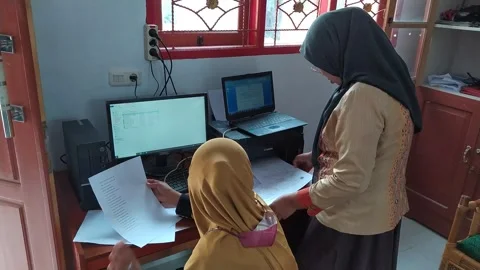 Muslim female employee is using a computer Stock Footage 287624020
