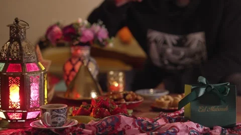 A Muslim holiday feast with sweets, dates, and a Ramadan gift box Stock Footage 308444454