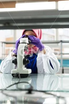 Photograph: muslim lab worker doing an analysis muslim lab worker doing ...