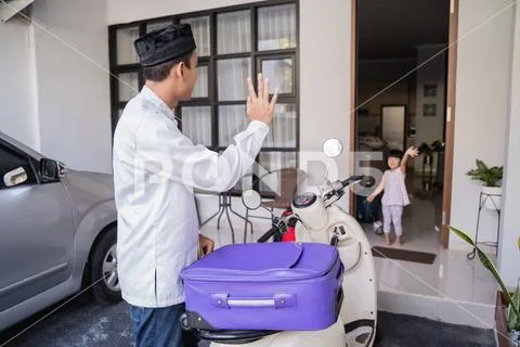 Muslim male travelling for eid mubarak lebaran by motorcyle Stock Photos