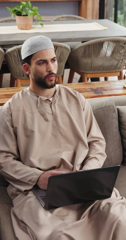 Muslim, man and remote work in home with laptop, research or typing news report Stock Footage 329395609