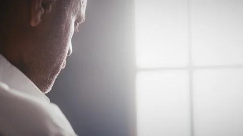 Muslim man in front of a window in the sunlight Stock Footage 275305915