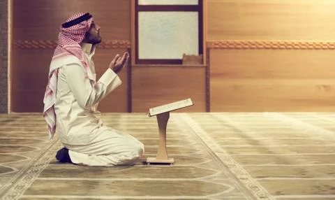 Muslim man praying inside the mosque Stock Photos