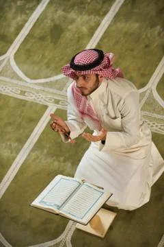 Muslim man praying inside the mosque Stock Photos