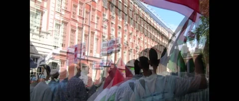 Muslim man shouting WHAT DO WE WANT JUSTICE at Palestinian Rally UK Stock Footage 144291748