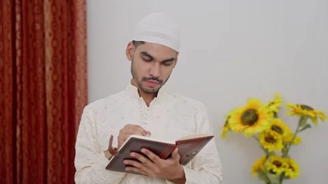Muslim Man Writing in Notebook Stock Footage 296983837