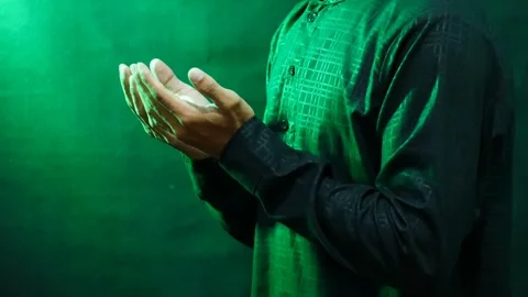 A Muslim man's hands in prayer during the holy month of Ramadan Stock Footage 265673655