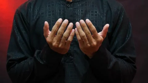 A Muslim man's hands in prayer during the holy month of Ramadan Stock Footage 265673662
