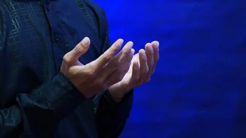 A Muslim man's hands in prayer during the holy month of Ramadan Stock Footage 265673692
