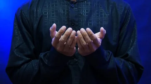 A Muslim man's hands in prayer during the holy month of Ramadan Stock Footage 265673694