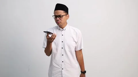Muslim men communicate long distance using cell phones, talking to someone Stock Footage 327695446