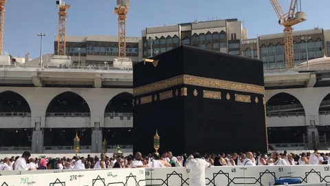 Muslim pilgrims make a 7 round walk (tawaf) around the Kaabah in Saudi Arabia. Stock Footage 94264989