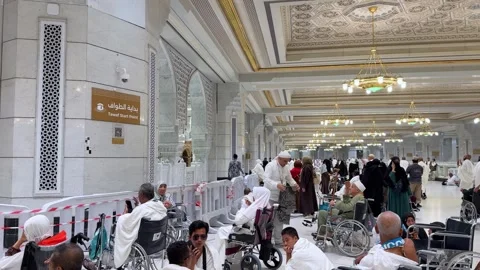 Muslim pilgrims perform Tawaf from the second floor inside Masjid Al Haram Stock Footage 339077614