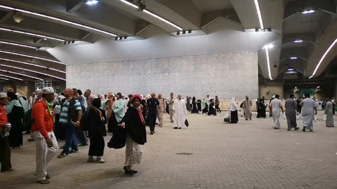 Muslim pilgrims performed a 'stoning of the devil' ritual at one of wall pillars Stock Footage 129736351
