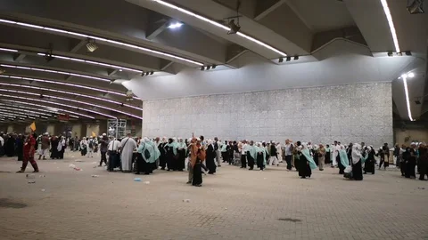 Muslim pilgrims performed a 'stoning of the devil' ritual at one of wall pillars Stock Footage 129736398