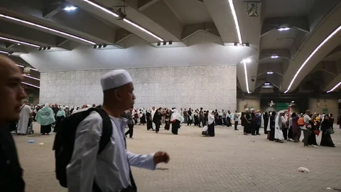 Muslim pilgrims performed a 'stoning of the devil' ritual at one of wall pillars Stock Footage 129736491