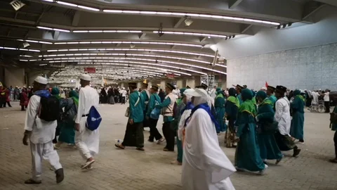 Muslim pilgrims performed a 'stoning of the devil' ritual at one of wall pillars Stock Footage 129736593
