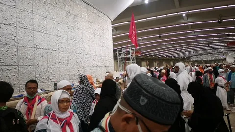 Muslim pilgrims performed a 'stoning of the devil' ritual at one of wall pillars Stock Footage 129736687
