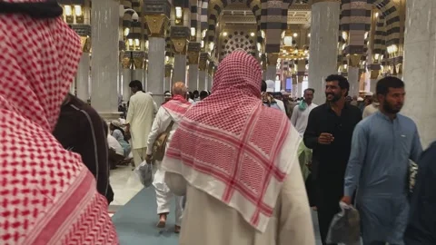 Muslim pilgrims walking inside Prophet's Mosque in Medina Stock Footage 339763701