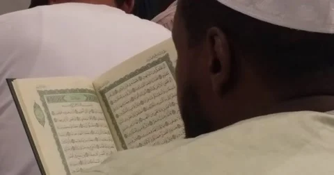 Muslim prayers reading Quran inside  Nabawi  mosque (Al Madinah), september 2016 Stock Footage 68758449