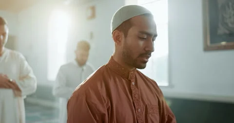 Muslim, praying and man in a Mosque for spiritual religion together as group to Stock Footage 249201072