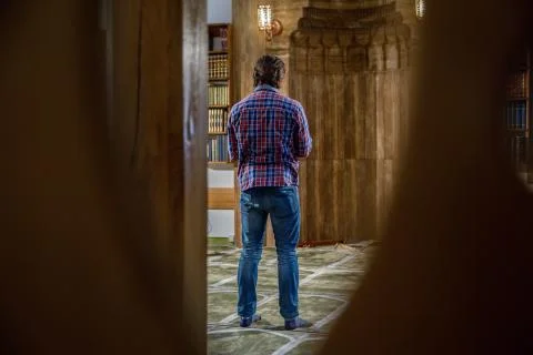 Muslim praying in a mosque Stock Photos