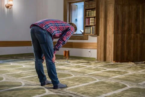Muslim praying in a mosque Stock Photos