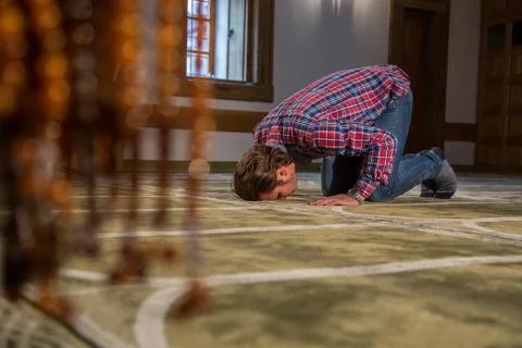 Muslim praying in a mosque Stock Photos