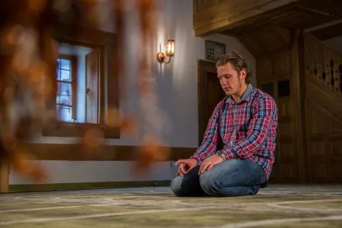 Muslim praying in a mosque Stock Photos