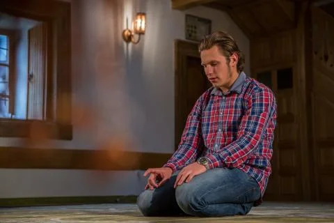 Muslim praying in a mosque Stock Photos