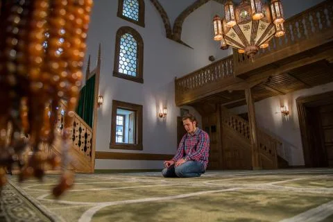 Muslim praying in a mosque Stock Photos