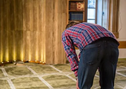 Muslim praying in a mosque Stock Photos