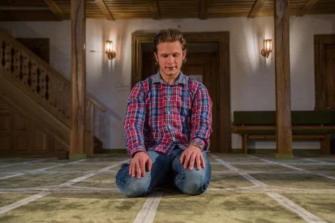 Muslim praying in a mosque Stock Photos