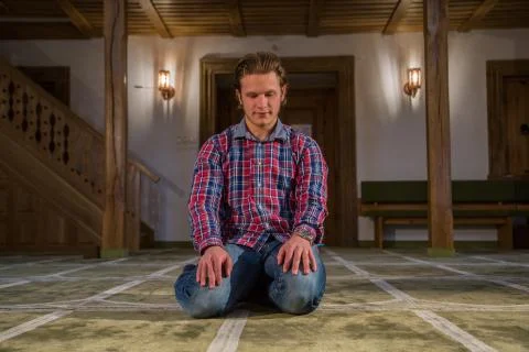 Muslim praying in a mosque Stock Photos