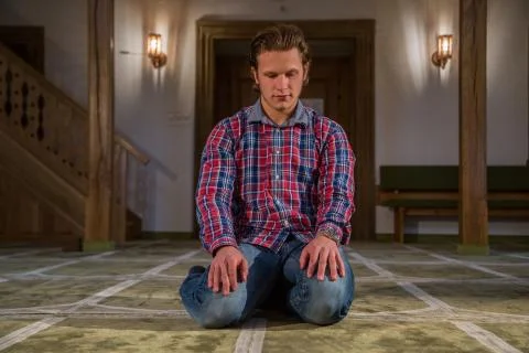 Muslim praying in a mosque Stock Photos