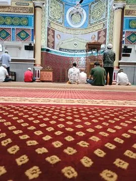 Muslim praying in mosque Stock Photos