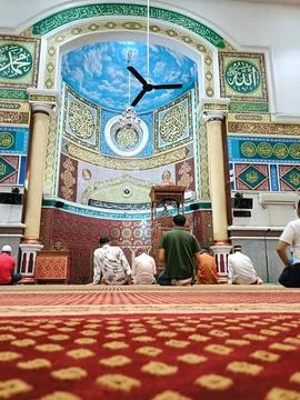 Muslim praying in mosque Stock Photos
