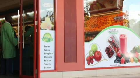 Muslim Shoppers Enter Vegetable Store   (HD) Stock Footage 12999765