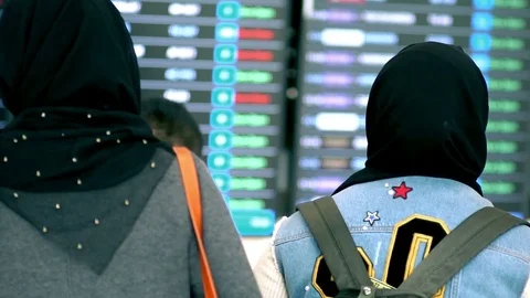 Muslim Tourist Checking Flight Information Board Stock Footage 79891243