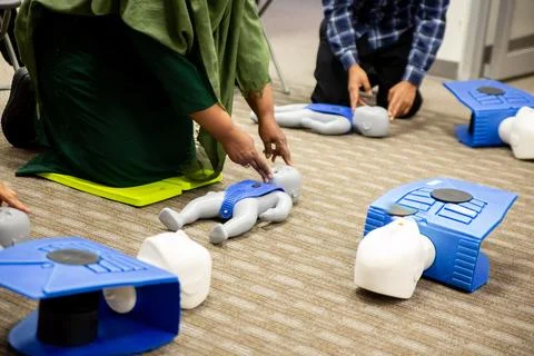 Muslim trainees taking cpr class and first aid Stock Photos