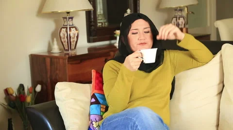 Muslim woman drinking coffee 3 Stock Footage 59199010