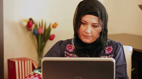 Muslim woman using computer Stock Footage 38517982