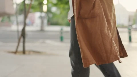 Muslim woman walking while using the mobile outdoors Stock Footage 204940711