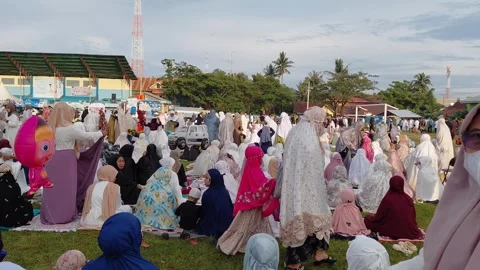 Muslim women preparing before Eid prayer at field in Majene Stock Footage 332627493